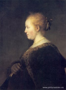 Una mujer joven de perfil con un abanico. Una mujer joven de perfil con un abanico.