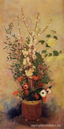 Jarrón de flores con ramas de un manzano en flor