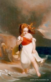 Niño en el lado del mar