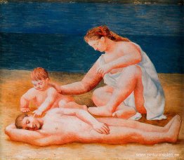 Familia a la orilla del mar