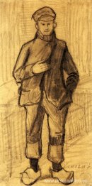 Niño con gorra y zuecos