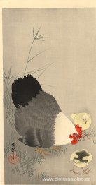 Gallina y dos polluelos en la hierba.