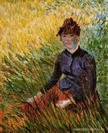 mujer sentada en la hierba