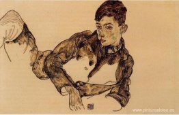 Niño reclinado apoyado en su codo Niño reclinado apoyado en su codo