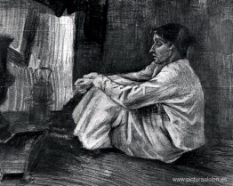 Sien con cigarro sentado en el suelo cerca de la estufa Sien con cigarro sentado en el suelo cerca de la estufa