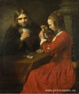 Un joven y una niña jugando a las cartas. Un joven y una niña jugando a las cartas.