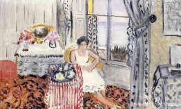 Mujer junto a una ventana Mujer junto a una ventana