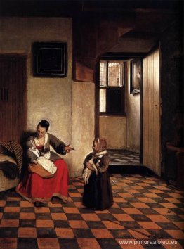 Una mujer con un bebé en su regazo y un niño pequeño. Una mujer con un bebé en su regazo y un niño pequeño.