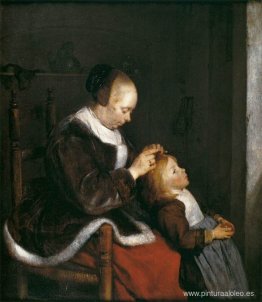 Madre peinando el cabello de su hijo Madre peinando el cabello de su hijo
