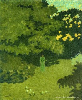 Mujer con un vestido verde en un jardín. Mujer con un vestido verde en un jardín.