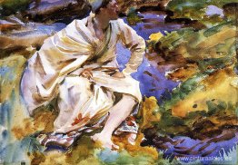 Un hombre sentado junto a un arroyo Un hombre sentado junto a un arroyo