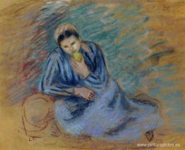 Mujer campesina sentada triturando una manzana Mujer campesina sentada triturando una manzana