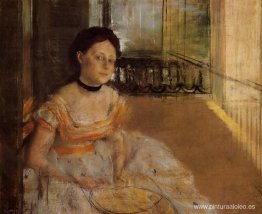 mujer sentada en un balcón mujer sentada en un balcón