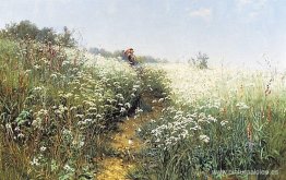Una mujer bajo un paraguas en un prado en flor Una mujer bajo un paraguas en un prado en flor
