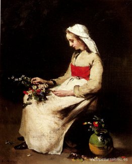 Una niña arreglando un jarrón de flores. Una niña arreglando un jarrón de flores.